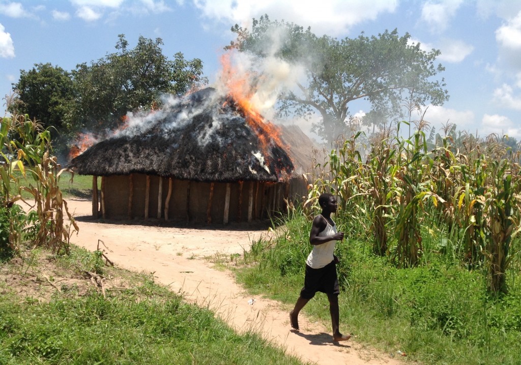 Moyo burning hut
