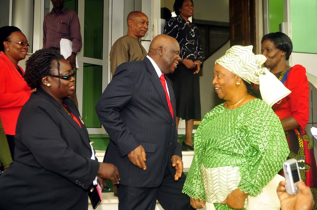 Nigeria High Commissioner to Uganda Cornelius O. Oluwateru (C) with his staff in the back ground bids farewell to women activists Uganda Women Network executive director Rita Aciro (2nd L) Dr. Thelma Awori (2nd R) Liberia Honorary Consul to Ugandan and Isis-Women’s International Cross Cultural Exchange, executive director Ruth Ojambo Ochienge (R) at the embassy in Kampala April 14, 2015 after they petitioned the embassy on the missing girls abducted by Boku Haram in Nigeria. They called on African Union to join Nigeria to rescue the abducted girls. (PHOTO: STEPHEN WANDERA)