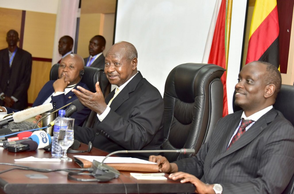 President Museveni flanked by EAC SG Amb Richard Sezibera
