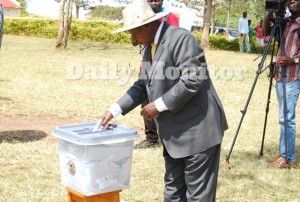 NRM presidential candidate Yoweri Museveni casts his vote at Kaaro polling station on Thursday. PHOTO BY COLLEB MUGUME
