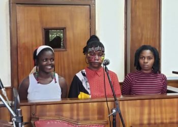 Three women remanded over nude protest