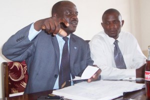 soccer002pix Fufa publicist Rogers Mulindwa (Left) addressing the Press recently